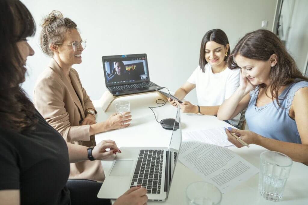 multishoring developers at a meeting about javascript development services