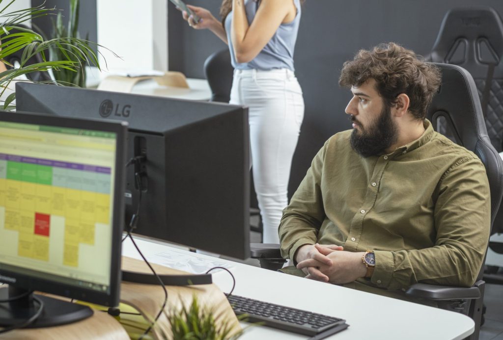 man in front of a laptop working on B2B integration services