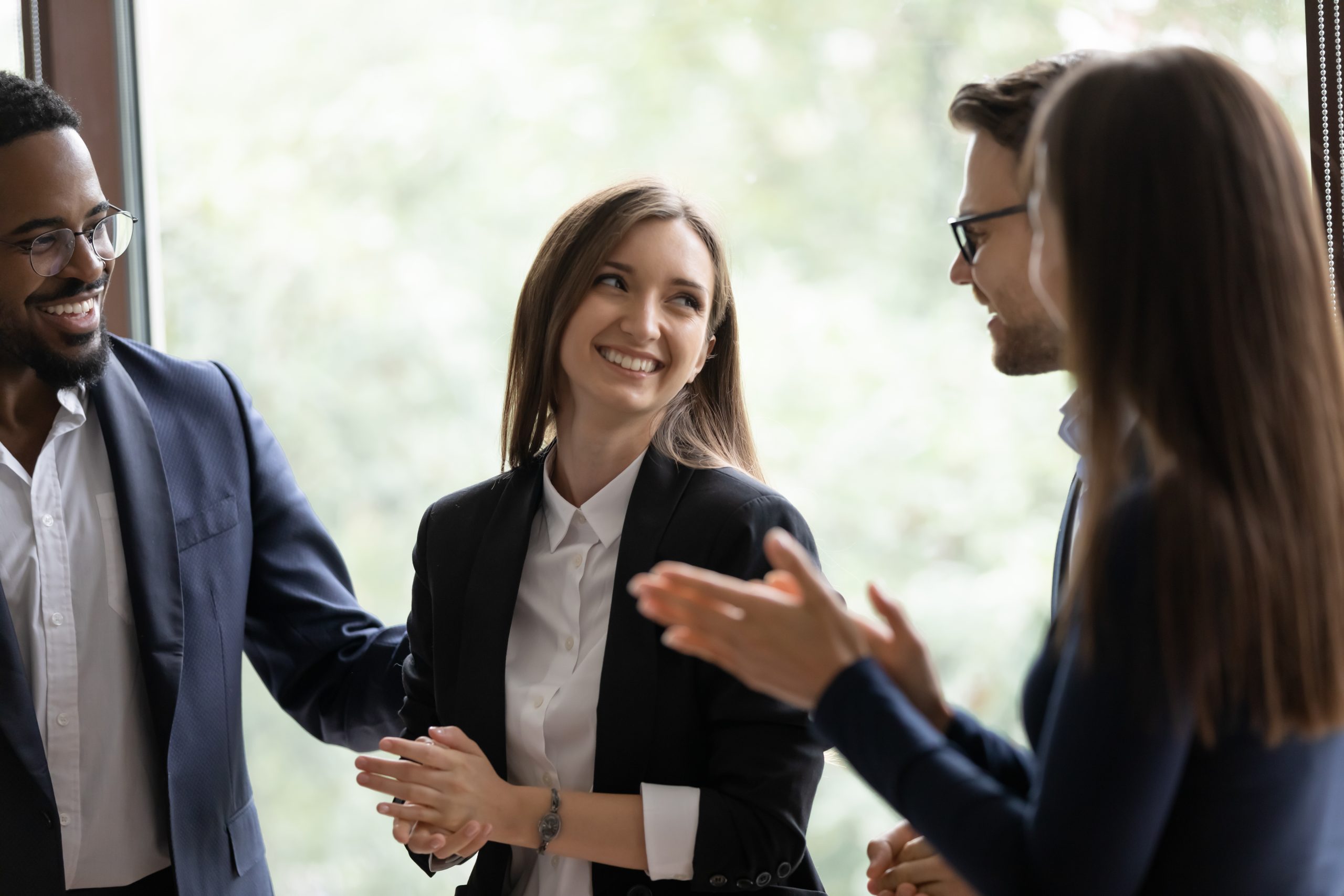 Diverse millennial colleagues talking about AWS consulting services
