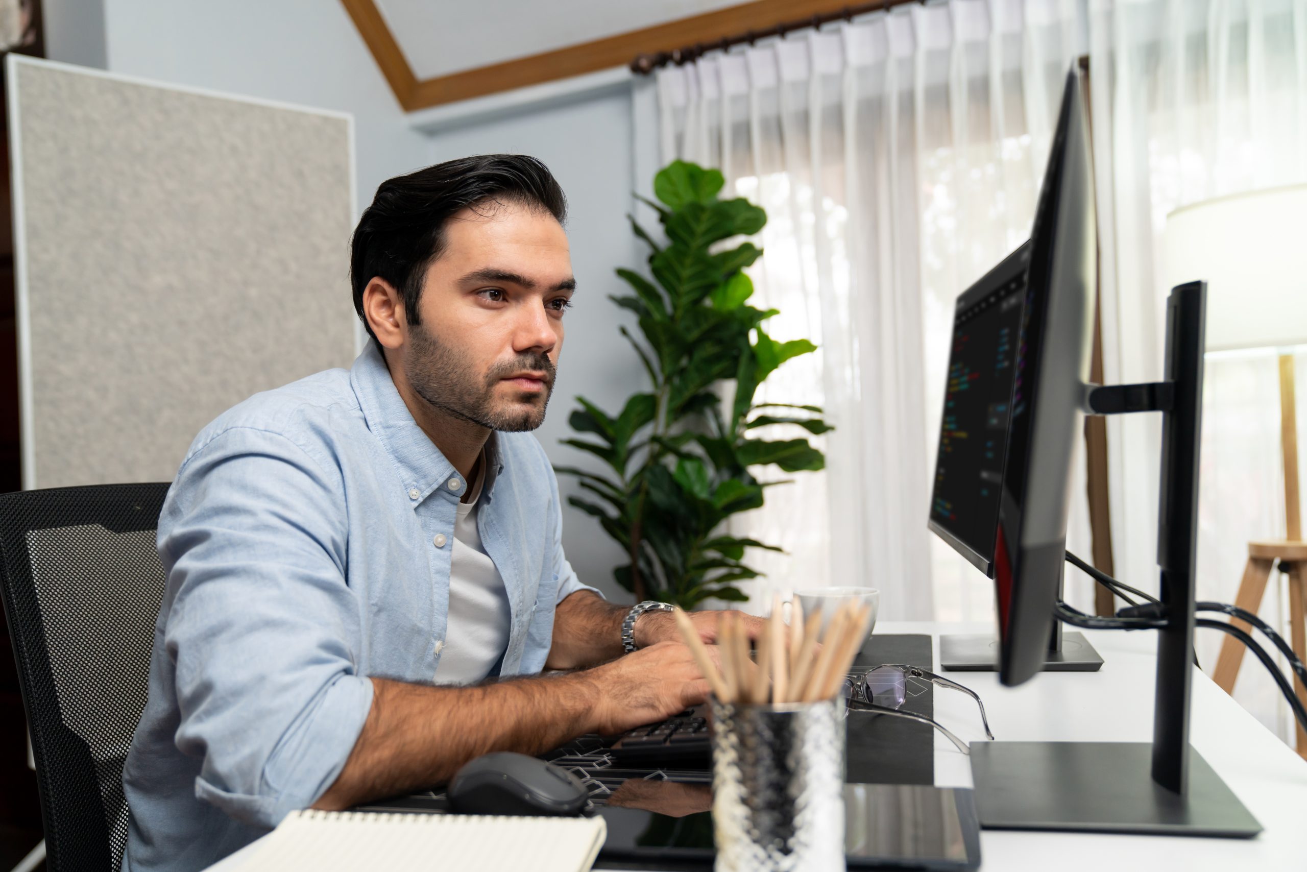 TIBCO expert consultant working on integration solutions in modern office environment, showcasing our professional development and consulting services