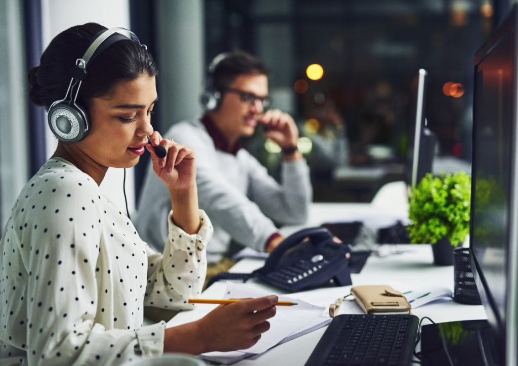 IT support professionals diagnosing and resolving Azure performance issues using monitoring tools in a modern office setting.